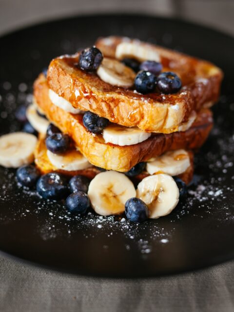 toast bread with blueberry on black plate